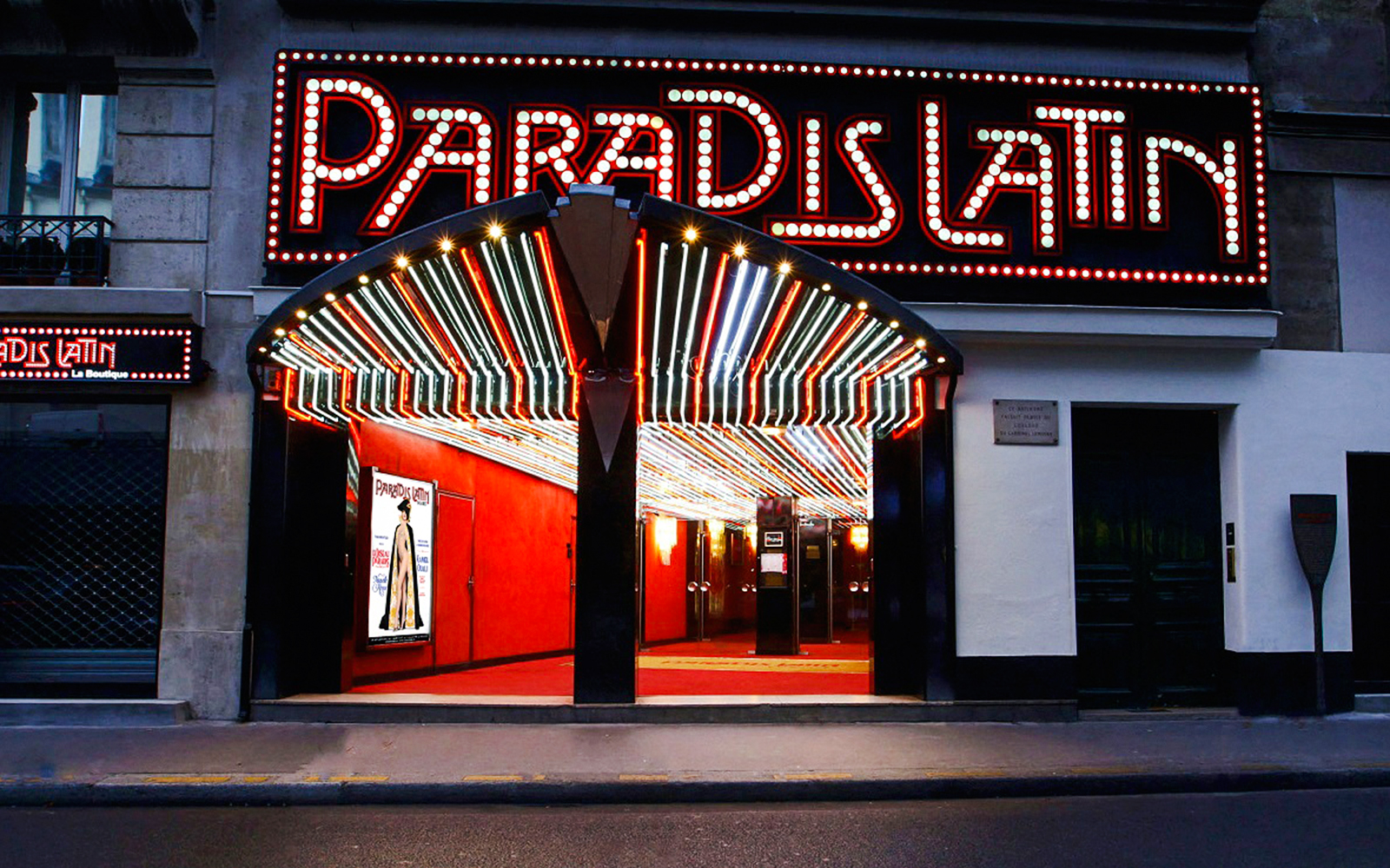 Paradis Latin entrance with illuminated marquee in Paris, France.