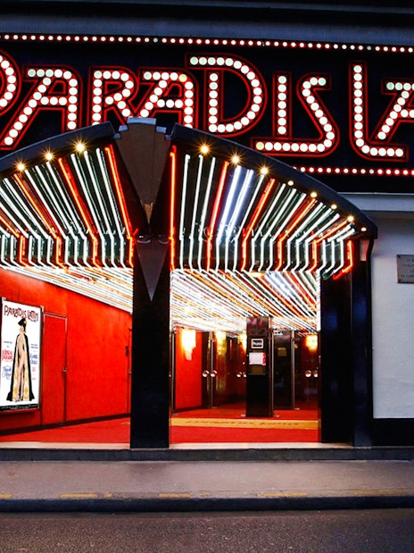 Paradis Latin entrance with illuminated marquee in Paris, France.