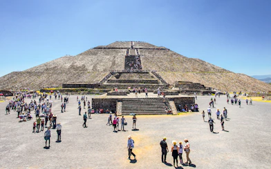 Visitors exploring the Sun Pyramid at Teotihuacan, Mexico.