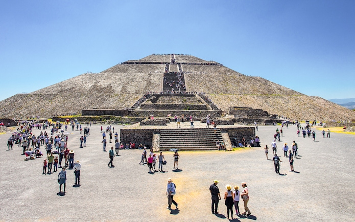 Visitors exploring the Sun Pyramid at Teotihuacan, Mexico.