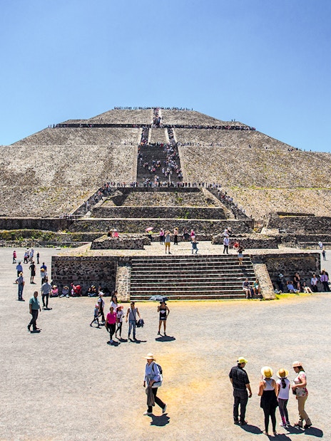 Visitors exploring the Sun Pyramid at Teotihuacan, Mexico.