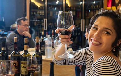 Woman enjoying wine tasting at a Chianti winery during Tuscany tour.