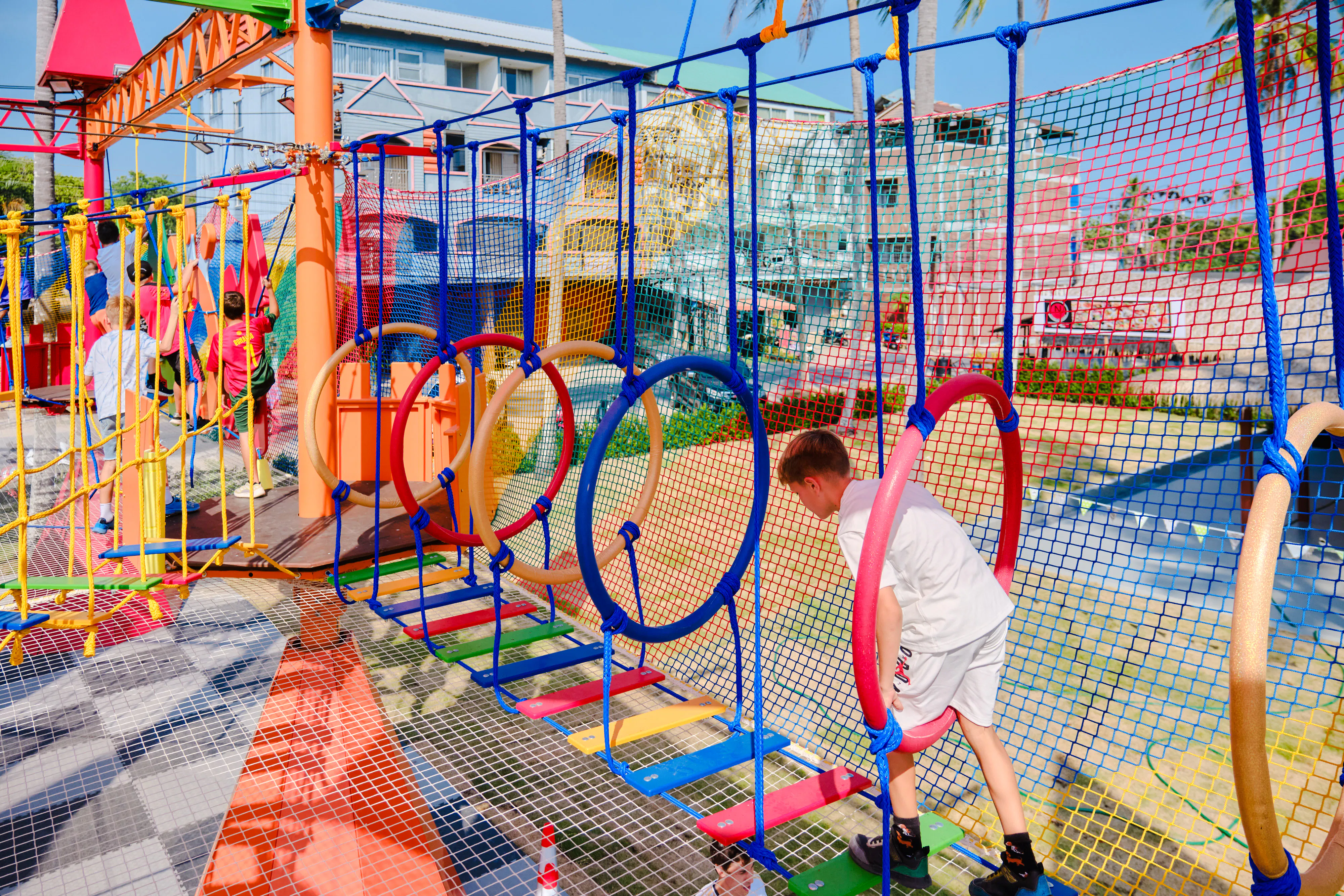 Children navigating colorful obstacle course at Ko Fun Kids Park, Phuket.