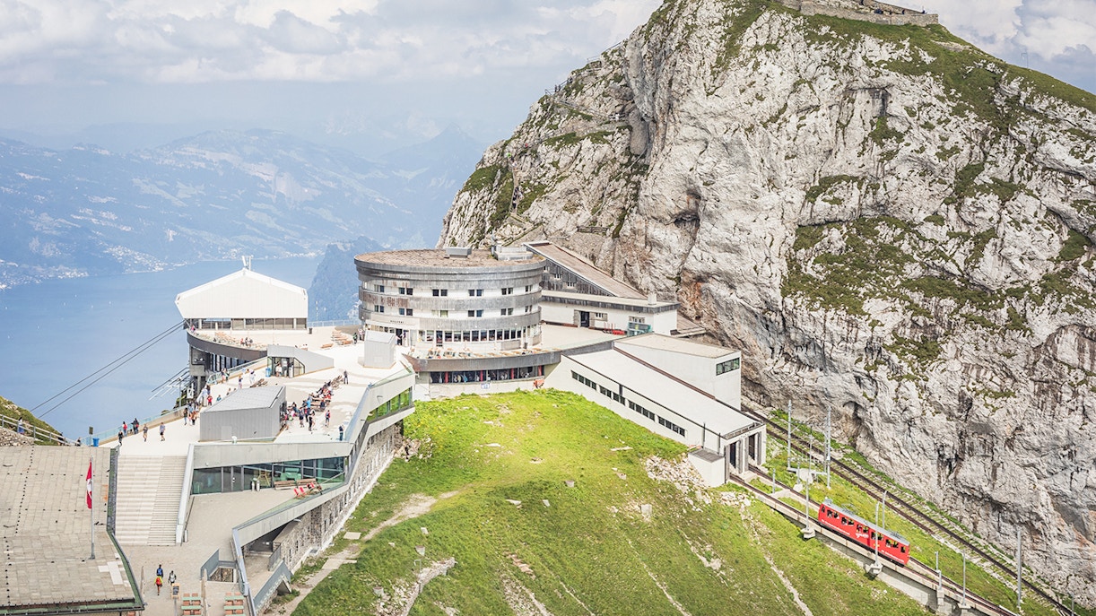 View of Mount Pilatus, overlooking Lucerne lake, with a cogwheel train coming in, Switzerland