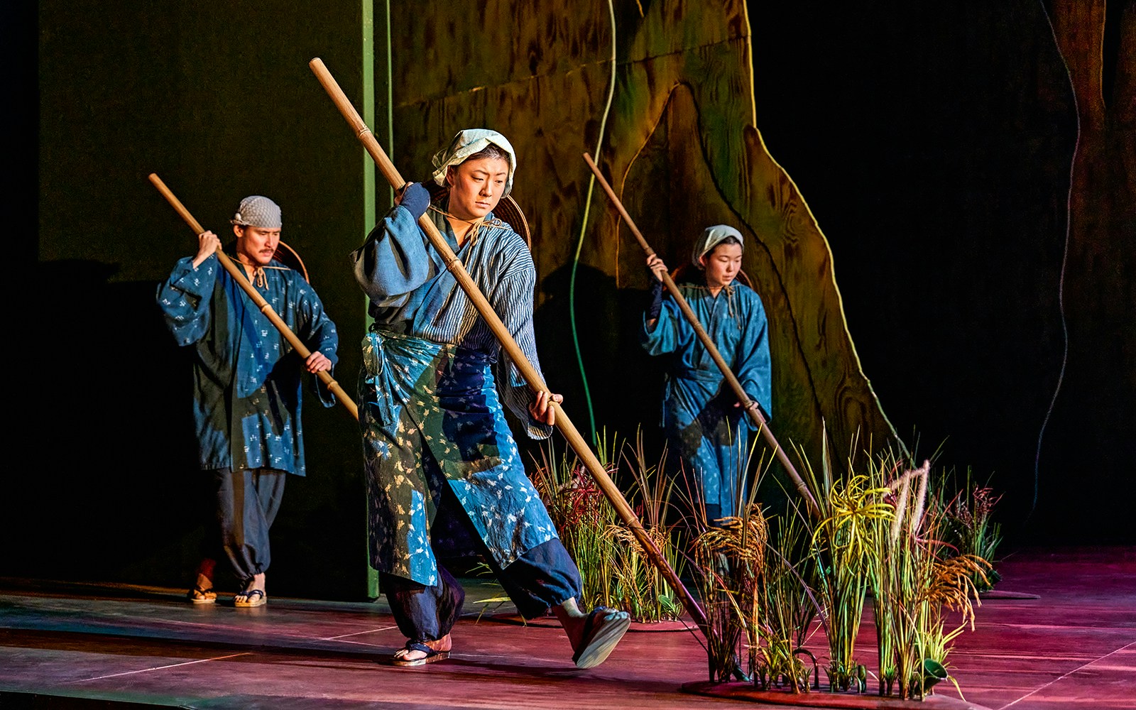 Performers in traditional attire on stage during My Neighbour Totoro show.
