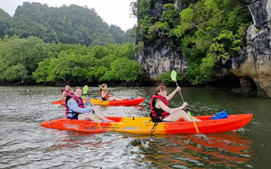 Kayakers paddling through mangroves at Ao Thalane, Krabi.