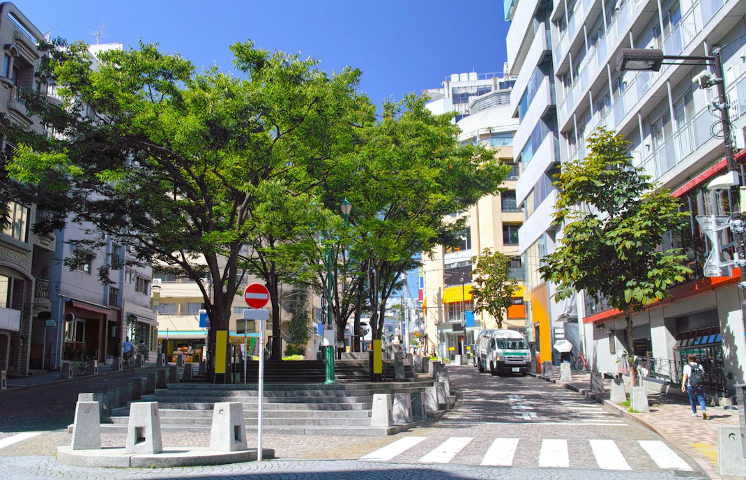 Azabu Juban Square with trees and buildings in Minato Ward, Tokyo.