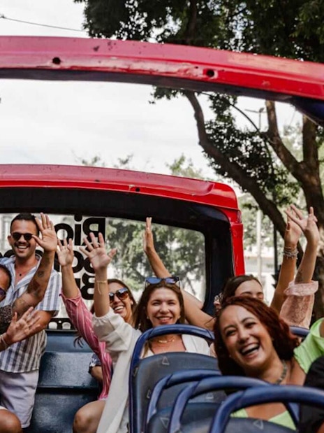 Tourists enjoying a ride on a Rio de Janeiro hop-on hop-off bus.