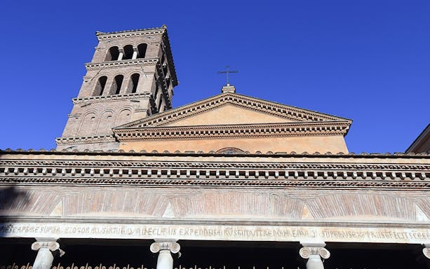 Ancient Roman church facade with bell tower in Rome, part of Velabrum Walking Tour.
