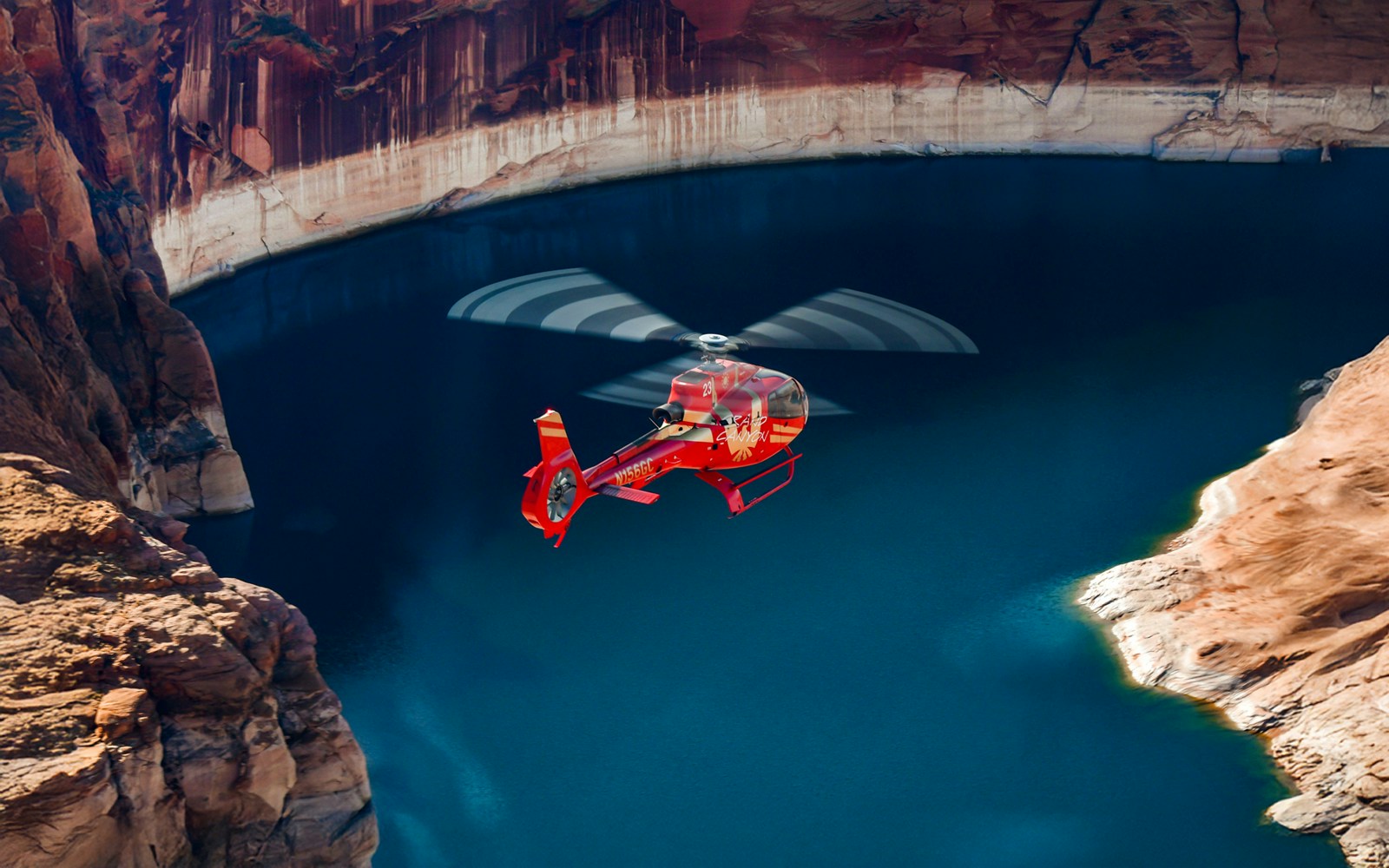 helicopter flying over hoover dam