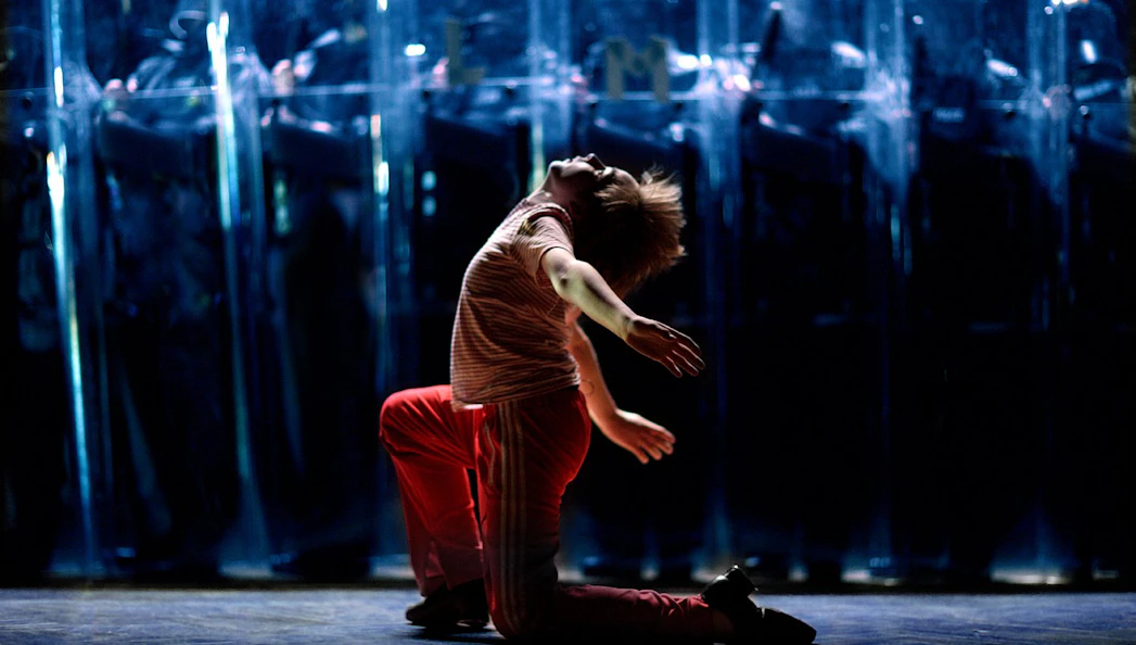 Performer dancing in Billy Elliot the Musical, West End stage.