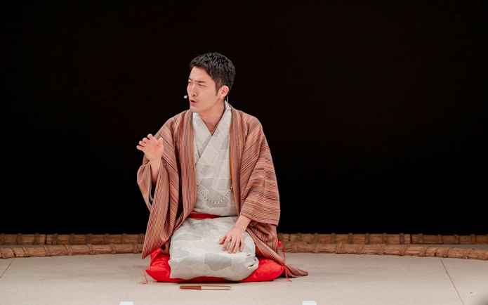 Sumo wrestler in traditional attire during training at Sumo Hall Hirakuzu, Osaka.