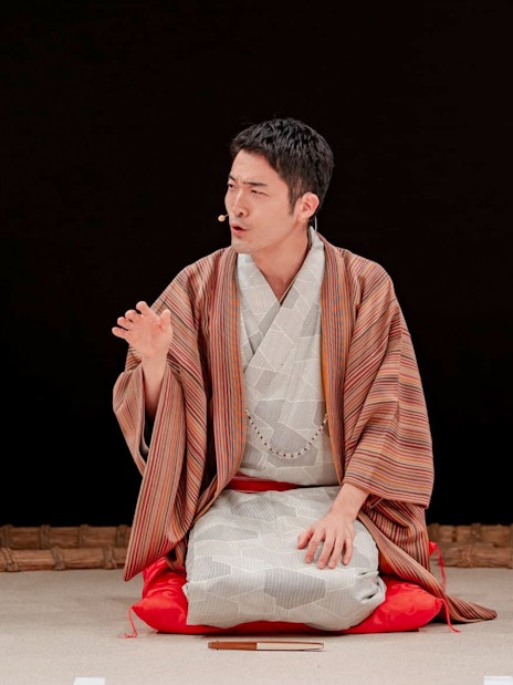 Sumo wrestler in traditional attire during training at Sumo Hall Hirakuzu, Osaka.