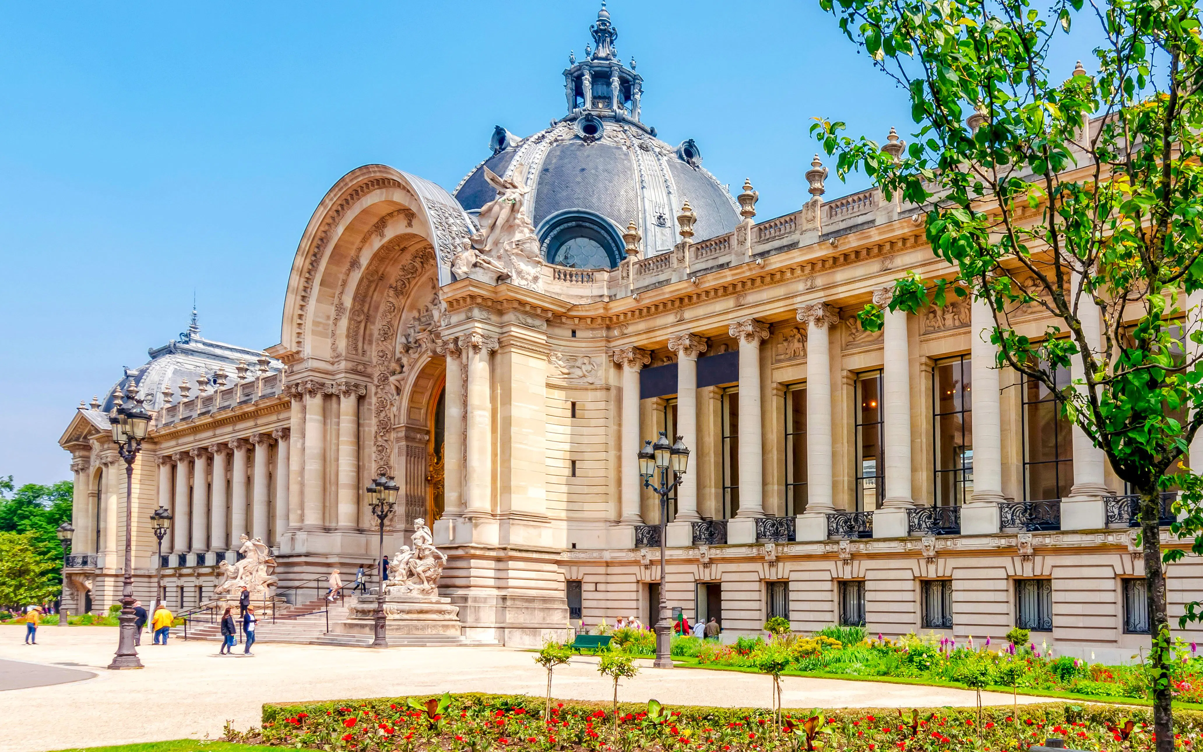 Petit Palais exterior with columns and sculptures, Paris walking tour, France.