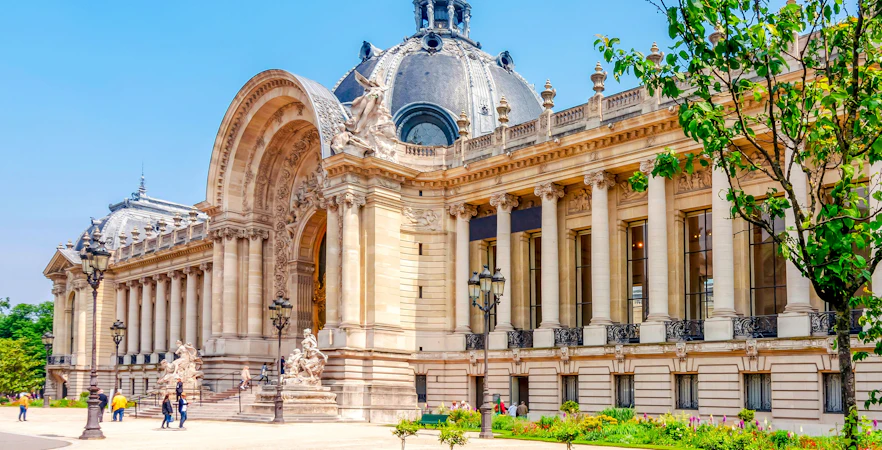 Petit Palais exterior with columns and sculptures, Paris walking tour, France.