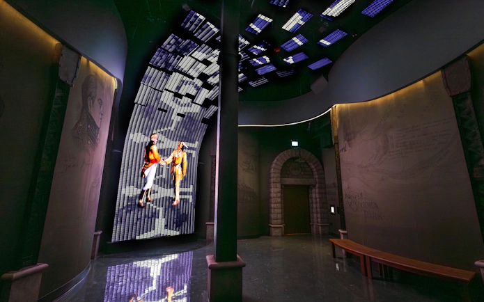 Interactive exhibit at Niagara Takes Flight, Canada, featuring historical figures on a digital display.