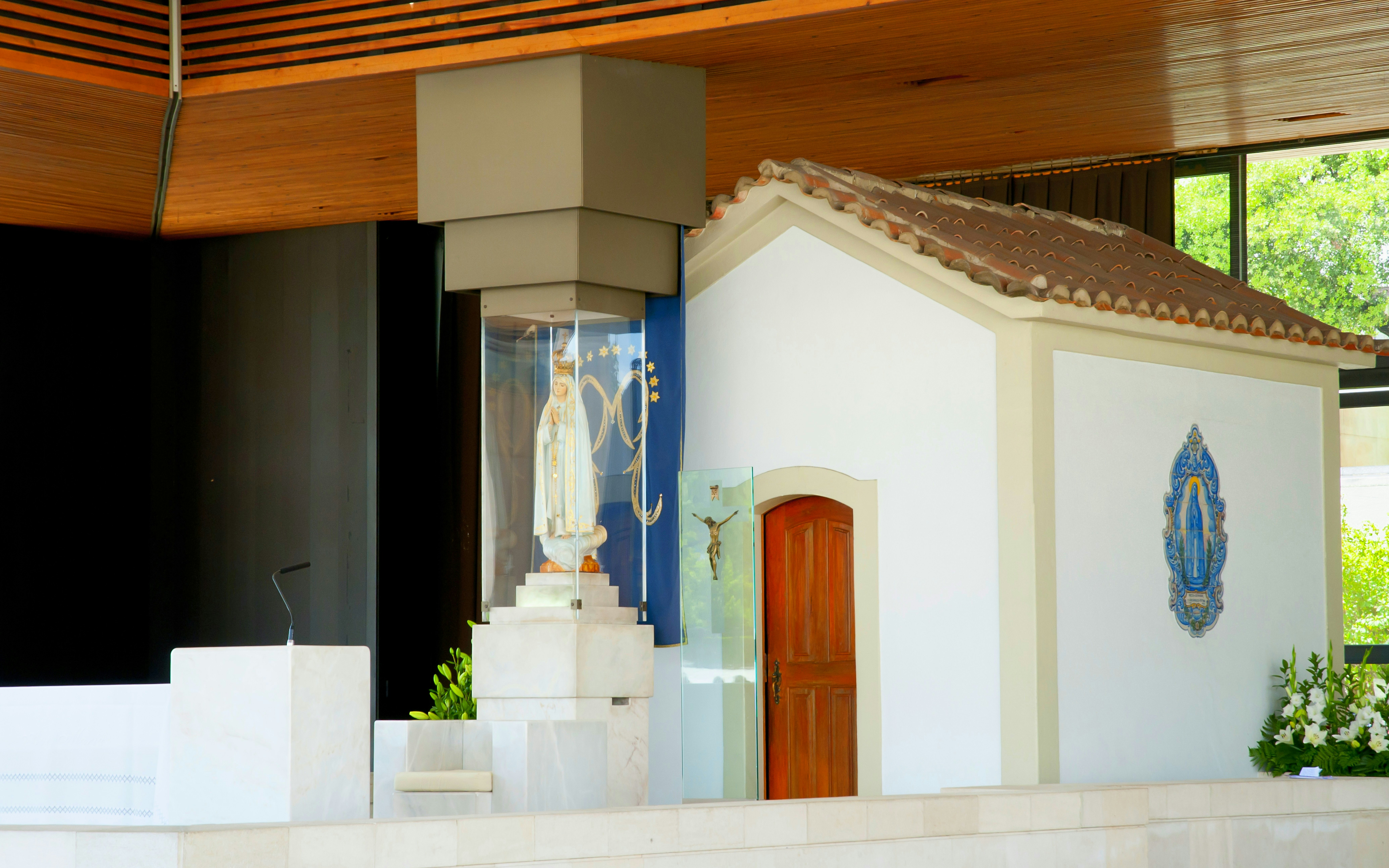 Fatima shrine with statue of Our Lady of Fatima inside a chapel.