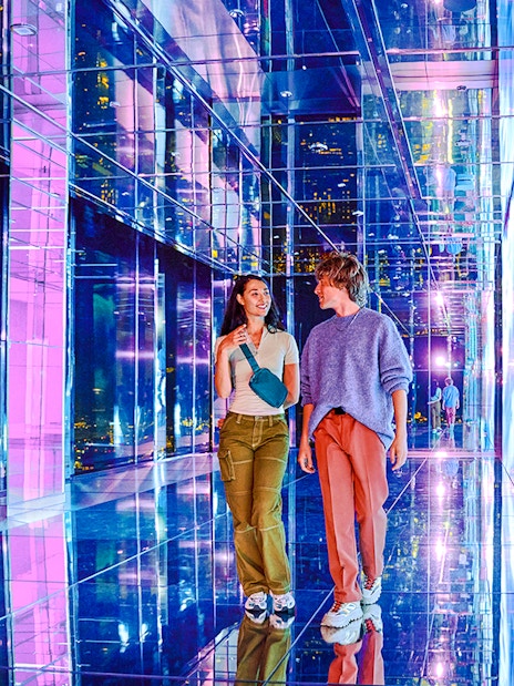 Guests exploring mirrored hallway at Summit One Vanderbilt, New York City.
