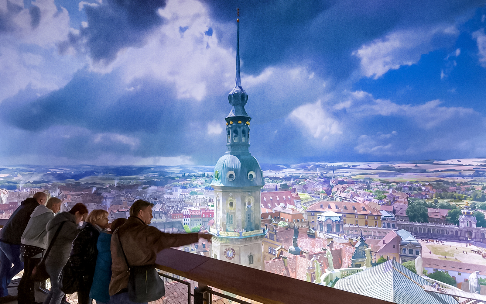 Visitors viewing panoramic cityscape at Panometer Dresden.