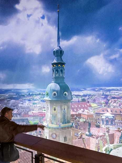 Visitors viewing panoramic cityscape at Panometer Dresden.