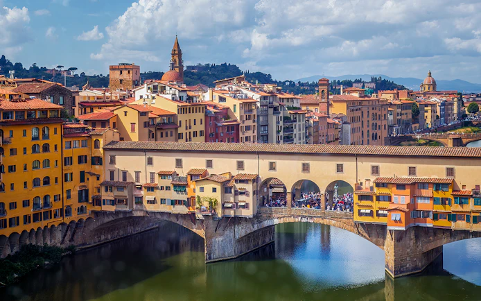 Ponte Vecchio bridge over the Arno River in Florence, Italy, seen on a day tour from Milan.