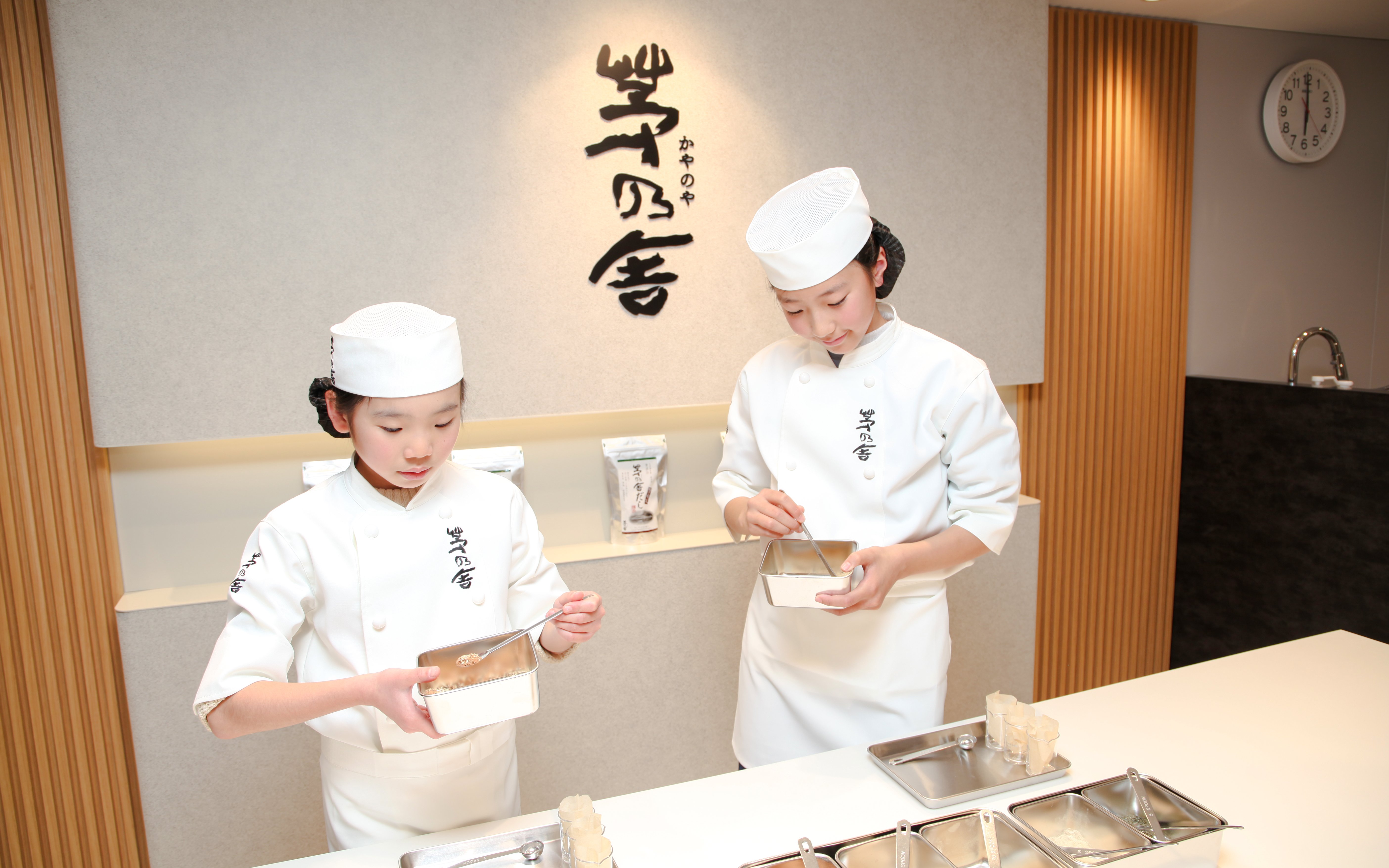 Children learning sushi making at KidZania Fukuoka.