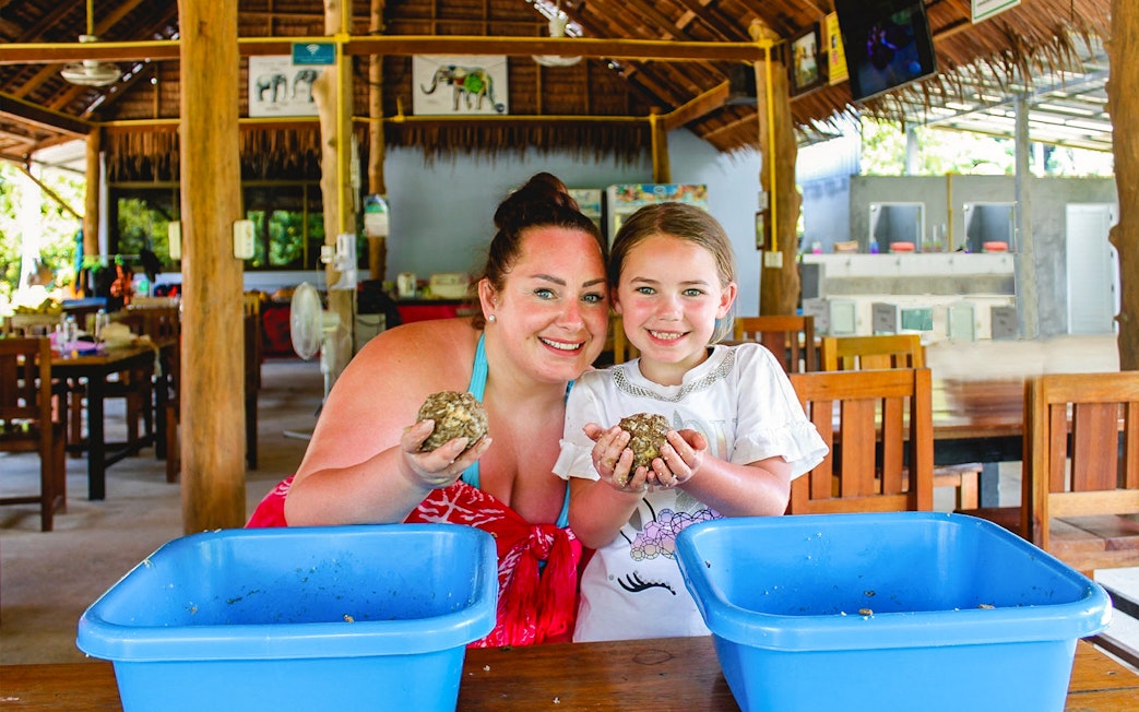 Visitors preparing elephant food at Ao Nang Elephant Sanctuary.