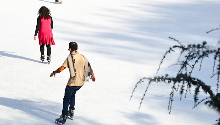 People ice skating at Wollman Rink in Central Park, New York City.