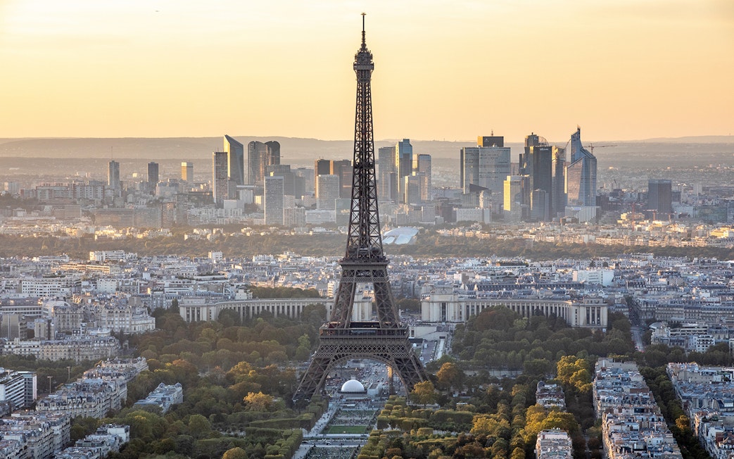 Eiffel Tower view from Montparnasse Tower, Paris skyline at sunset.