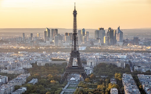 Eiffel Tower view from Montparnasse Tower, Paris skyline at sunset.