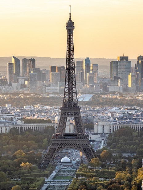 Eiffel Tower view from Montparnasse Tower, Paris skyline at sunset.