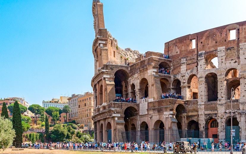 Colosseum in Rome with tourists on an express guided tour.