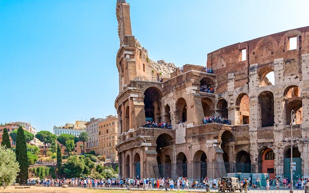 Colosseum in Rome with tourists on an express guided tour.