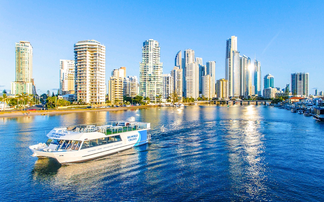 Spirit of Elston vessel cruising Gold Coast waters with city skyline in background.