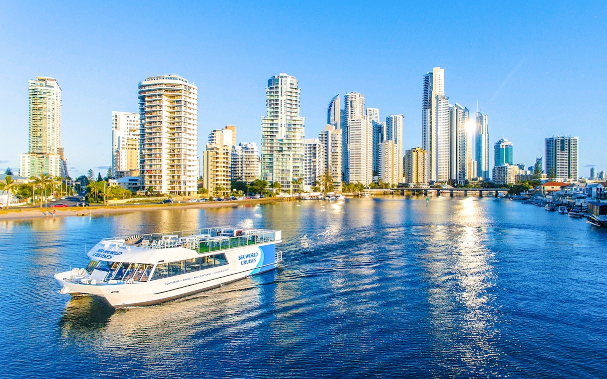 Spirit of Elston vessel cruising Gold Coast waters with city skyline in background.
