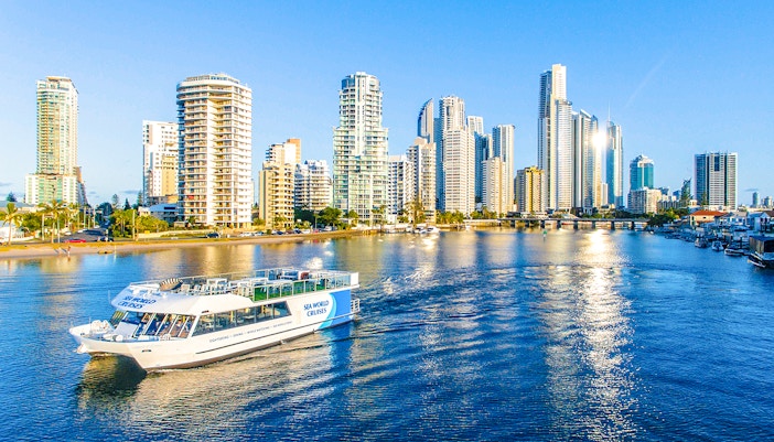 Spirit of Elston vessel cruising Gold Coast waters with city skyline in background.