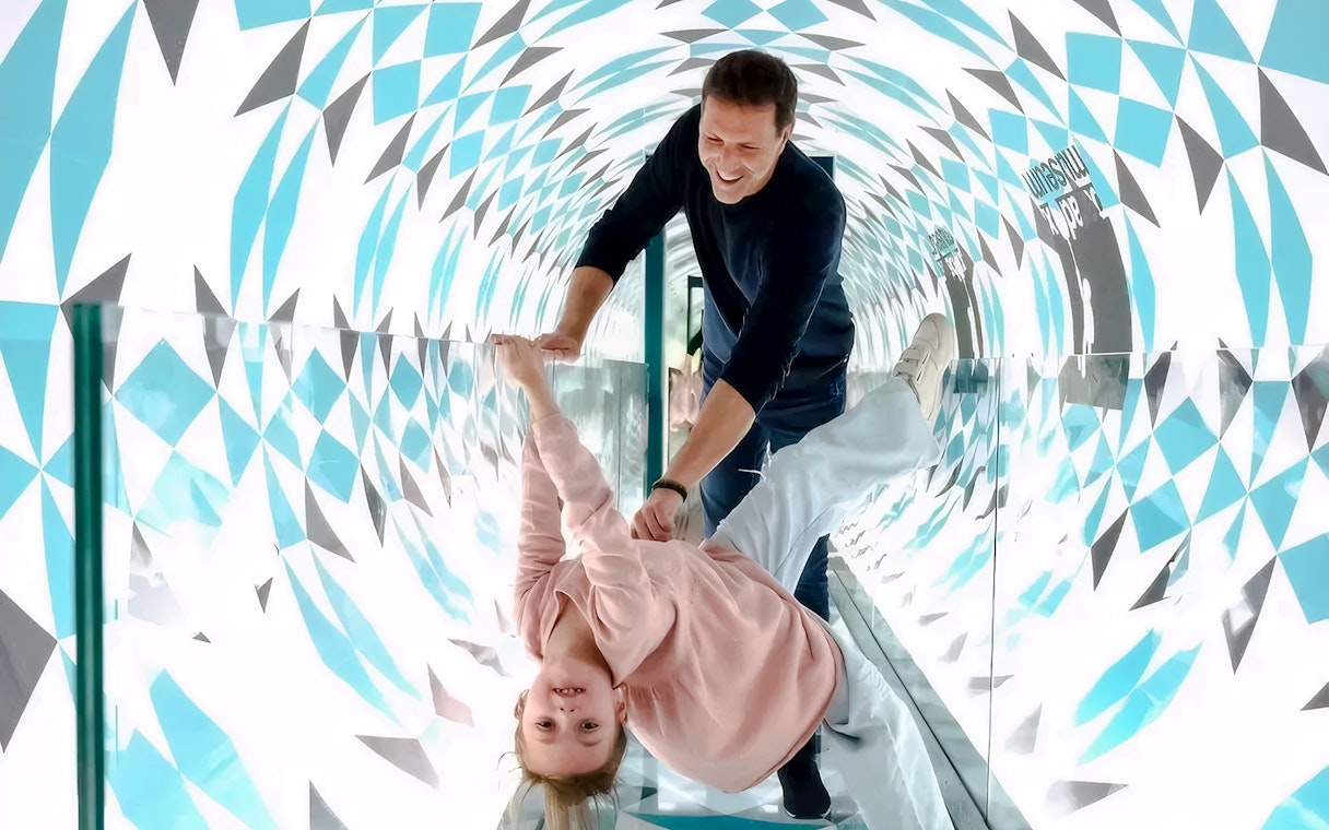 Visitors enjoying the Paradox Tunnel at Paradox Museum Paris.