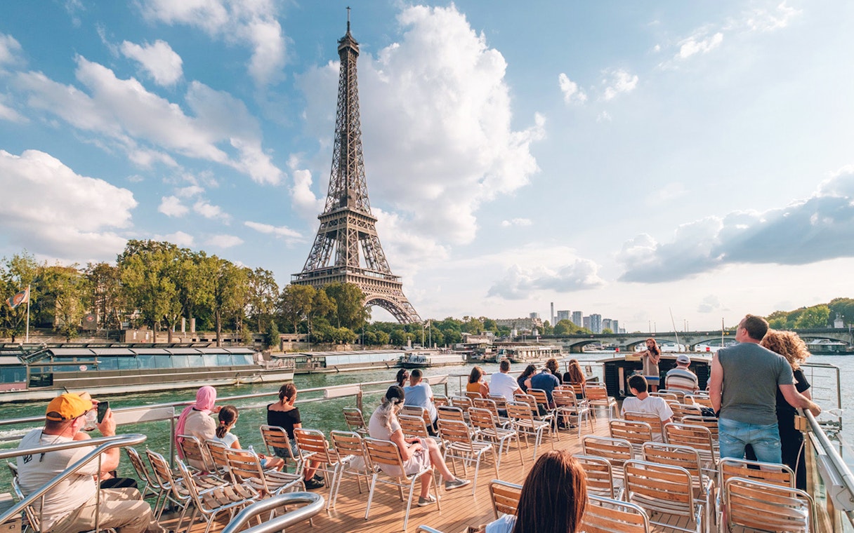 Sightseeing cruise on the Seine River with view of the Eiffel Tower in Paris.