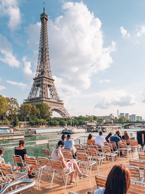 Sightseeing cruise on the Seine River with view of the Eiffel Tower in Paris.