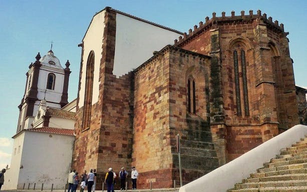 Historic church with tourists in Silves, Western Algarve.