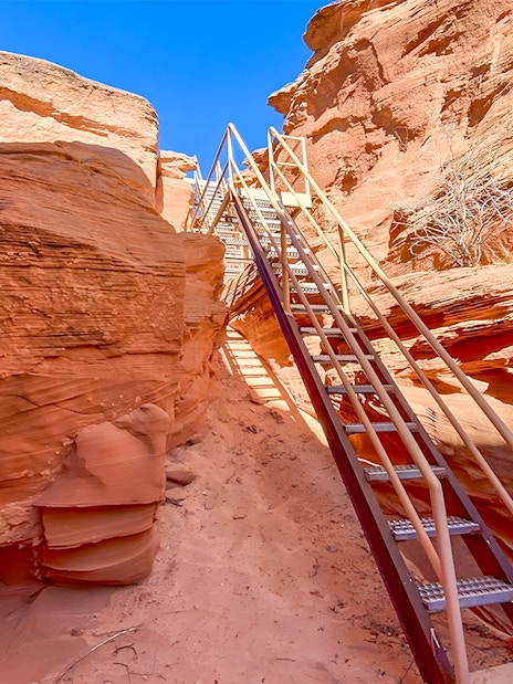 Staircase leading through red rock formations in Antelope Canyon.