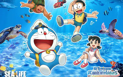 Doraemon characters exploring underwater at SEA LIFE Bangkok with marine animals.