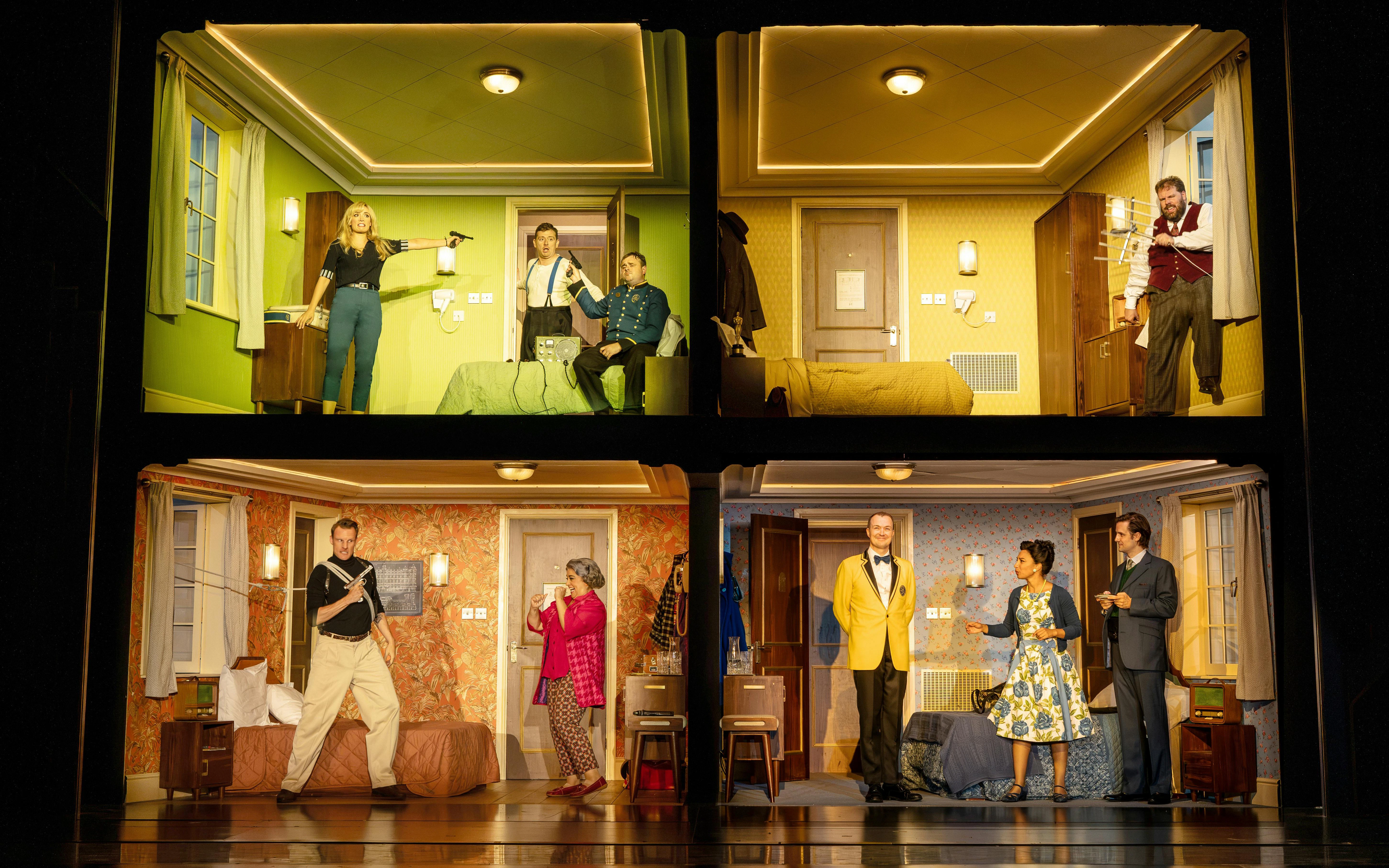 Performance scenes from "The Comedy About Spies" showing actors in various comedic hotel room settings.