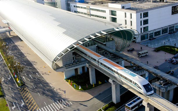Shanghai Maglev Train departing from a modern station in Shanghai, China.