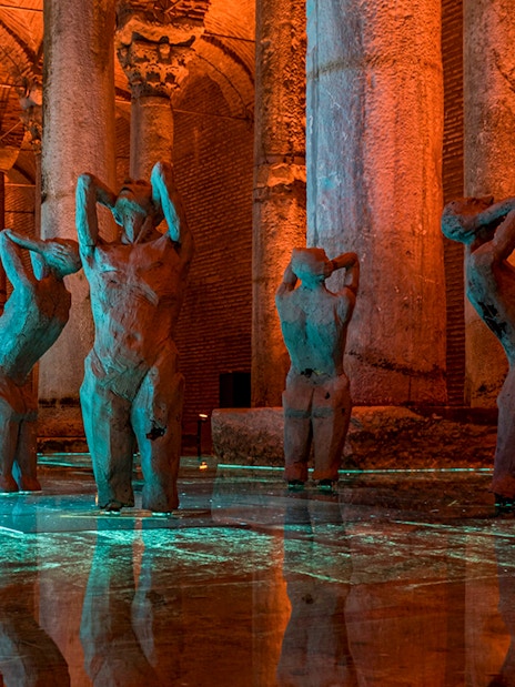 Basilica Cistern interior with illuminated columns and statues, Istanbul tour.
