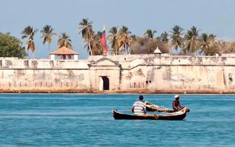 Two people in a boat near Fuerte de San Fernando, Bocachica, Isla Tierra Bomba, Colombia.
