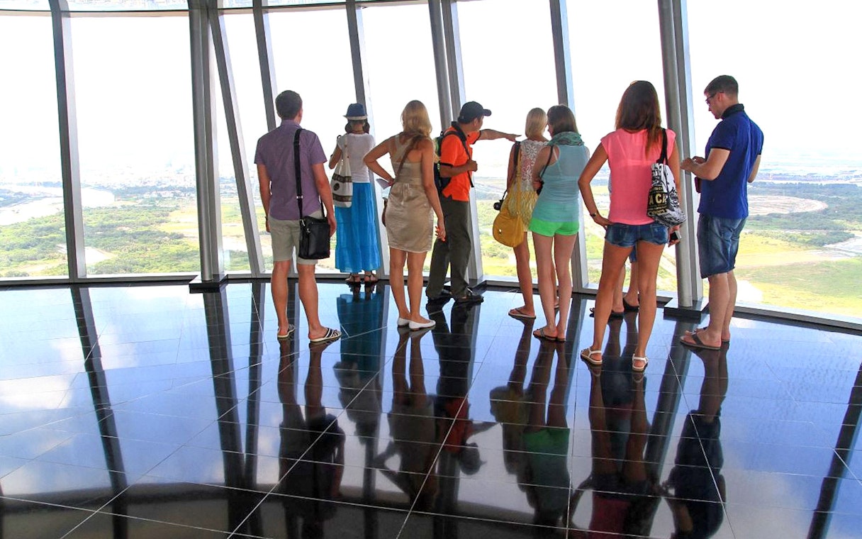 Visitors enjoying the view from Saigon Skydeck in Bitexco Financial Tower, Ho Chi Minh City.