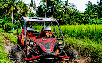 Buggy ride through rice fields and jungle tracks in Ubud, Bali.