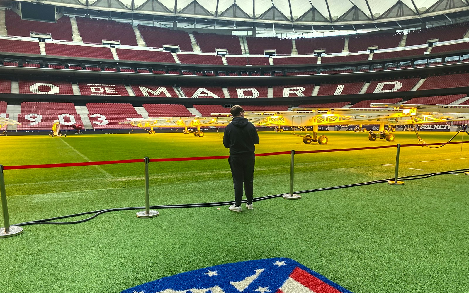 Tourist observing the field at Santiago Bernabeu Stadium, Madrid.