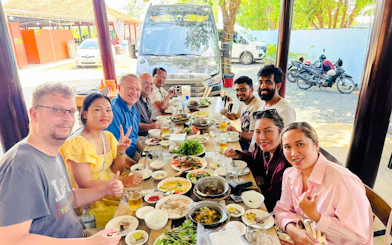 Group dining at a local restaurant near Black Virgin Mountain, Tay Ninh, during a tour from Ho Chi Minh City.